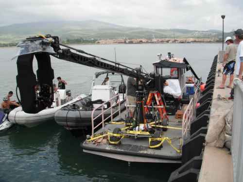 A jib arm rigged out over the water